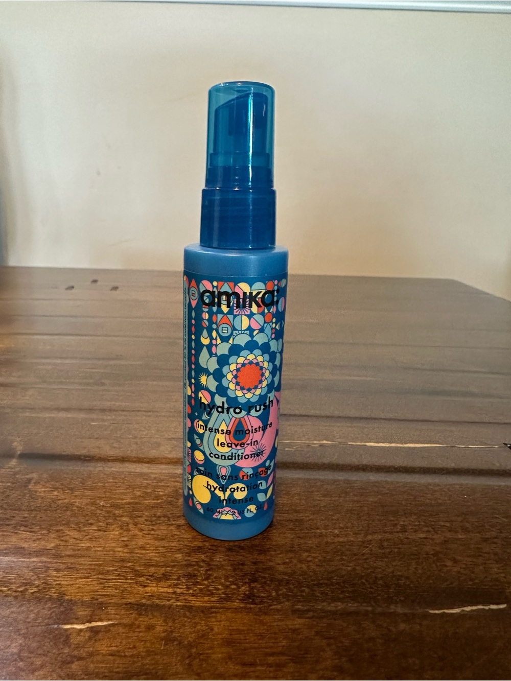 amika Hydro Rush Leave-In Conditioner — Bright Blue Bottle